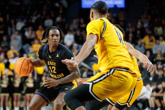 Dec 31, 2022; Wichita, Kansas, USA; East Carolina Pirates guard Javon Small (12) looks for an opening during the first half against the Wichita State Shockers at Charles Koch Arena. Mandatory Credit: William Purnell-USA TODAY Sports